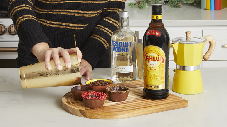 Espresso martini being poured into cocoa cup