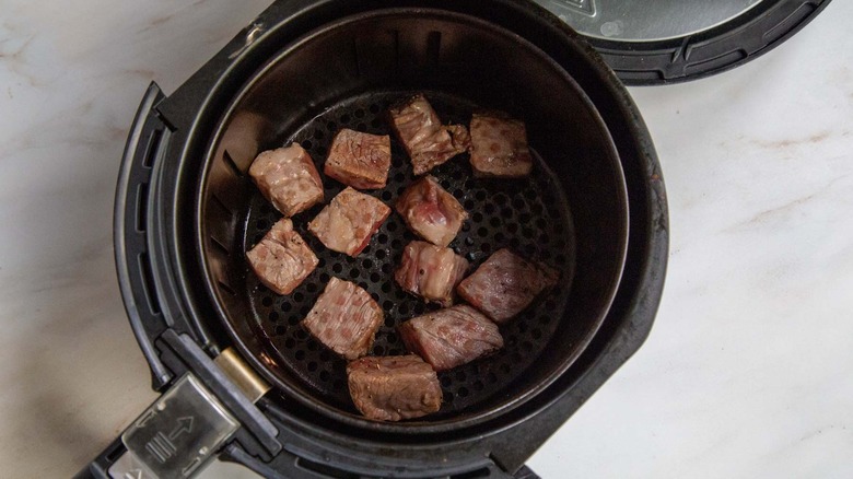 steak bites cooking in air fryer