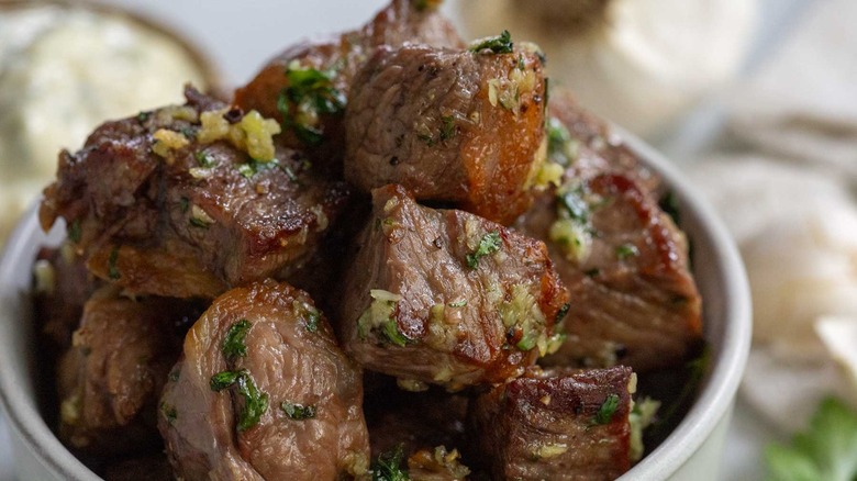 close up of bowl of garlic herb steak bites