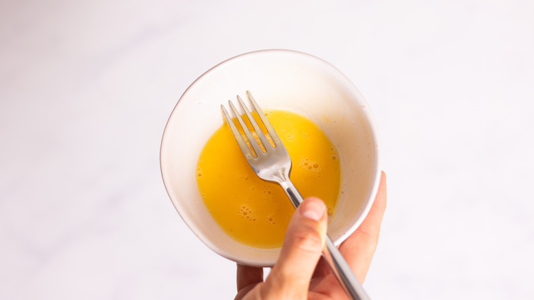 whisked egg in bowl 