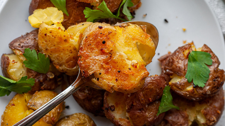 smashed potatoes on a plate 