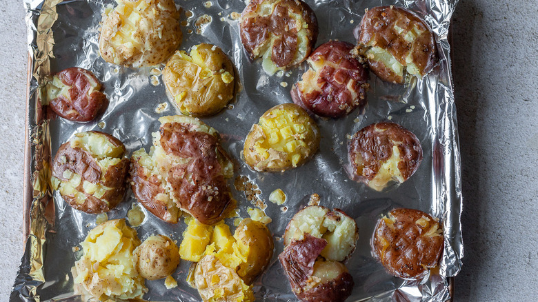 smashed potatoes on a baking tray