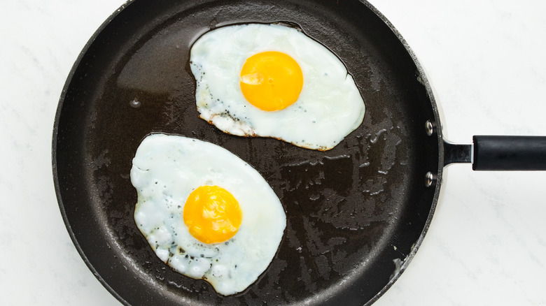 fried eggs in skillet