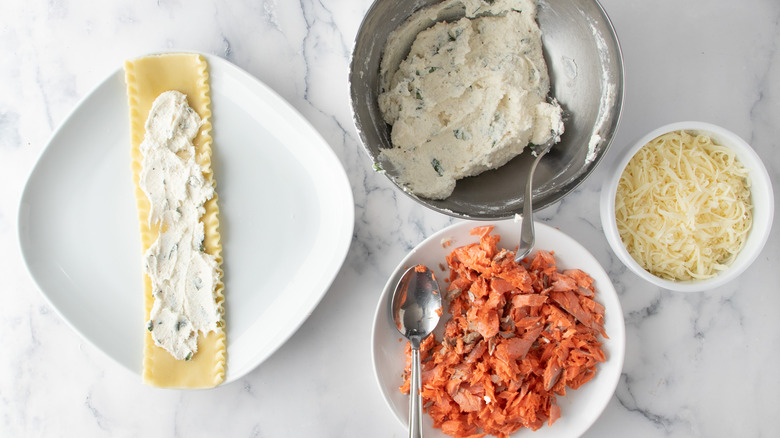 assembling lasagna rolls with ingredients