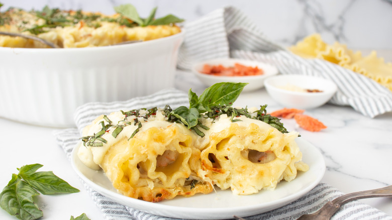 Alfredo salmon lasagna rolls on plate