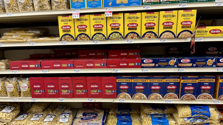 Boxes of assorted pasta on store shelves