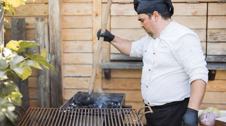 chef cooking with charcoal