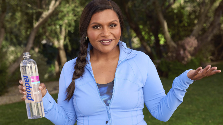 Mindy Kaling holds propel water