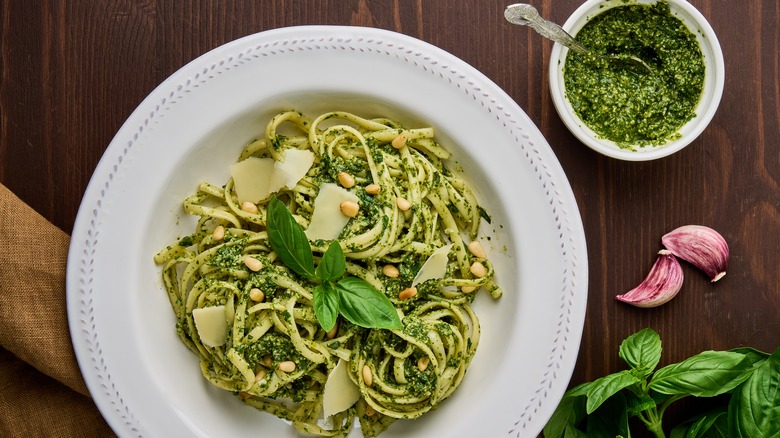 Pesto pasta with bowl of pesto