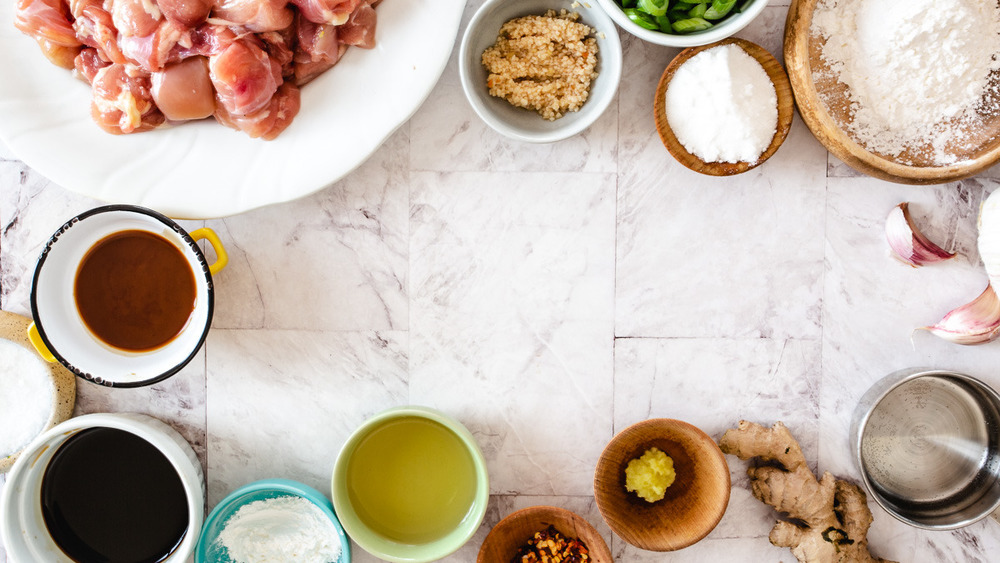 ingredients for general tso chicken on stone tile