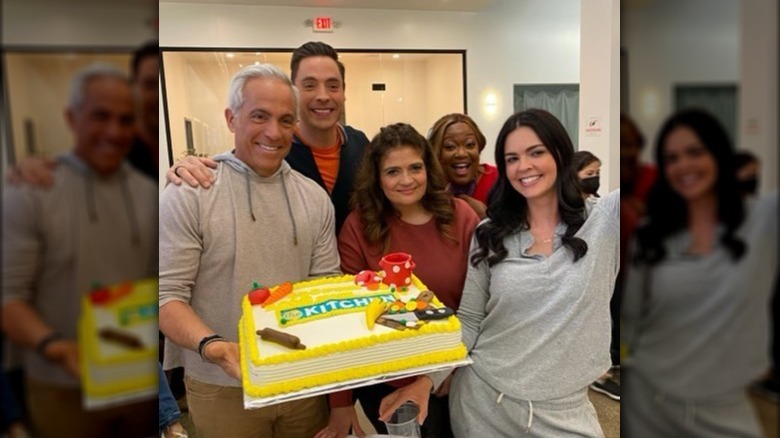 "The Kitchen" hosts with cake