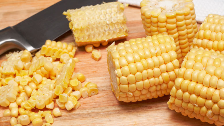Corn kernels being cut off the cob 