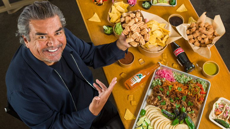 George Lopez showing off taco spread