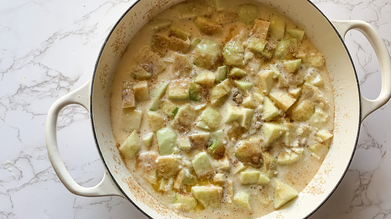 Batter and apples in skillet