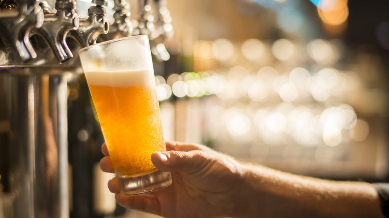 Pouring beer from tap