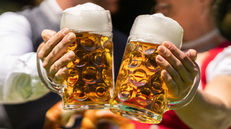 People toasting glasses of beer