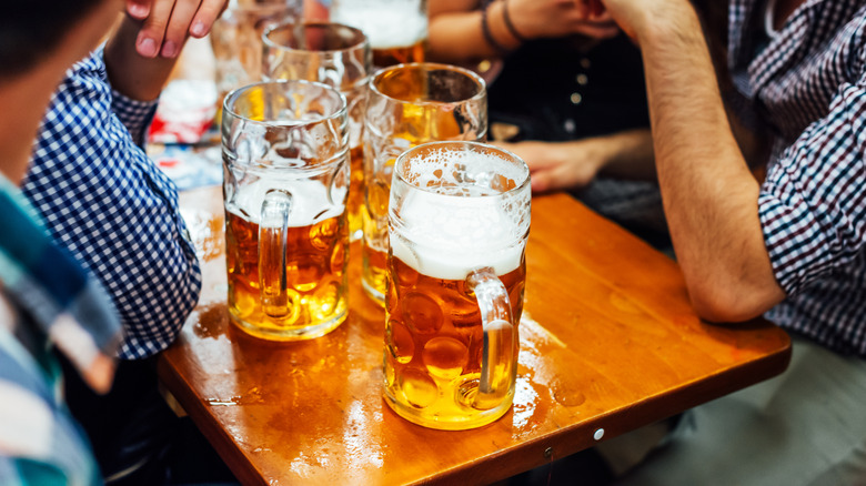 Beer in mugs on a wooden table