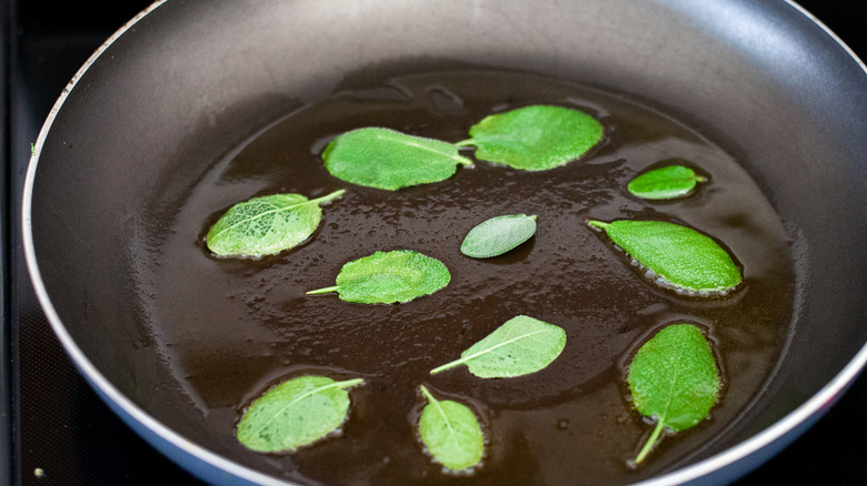 Sage leaves frying in oil