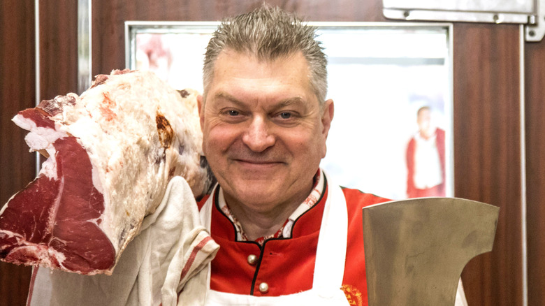 Dario Cecchini carrying raw meat