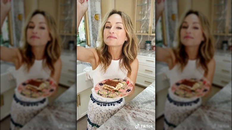 Giada De Laurentiis eating a piece of tiramisu.