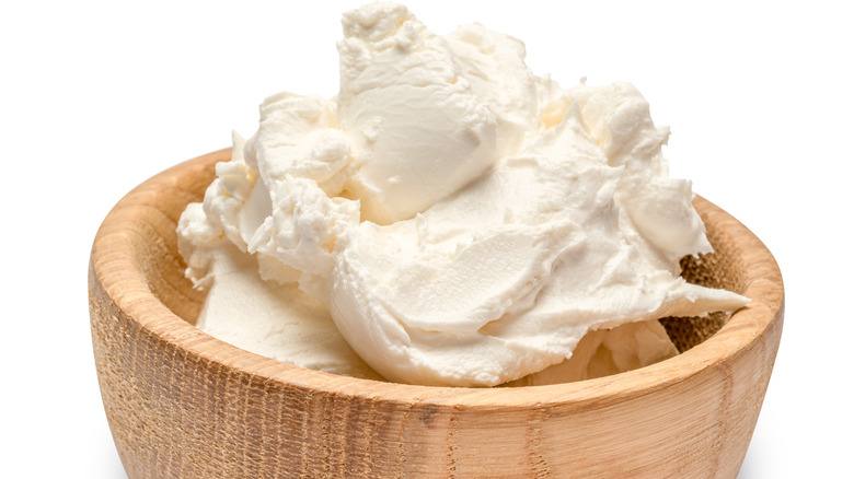 Mascarpone cheese in a wooden bowl