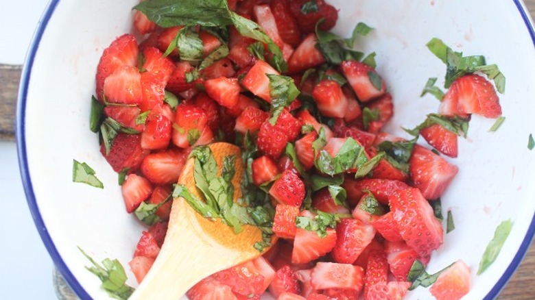 sliced strawberries in bowl