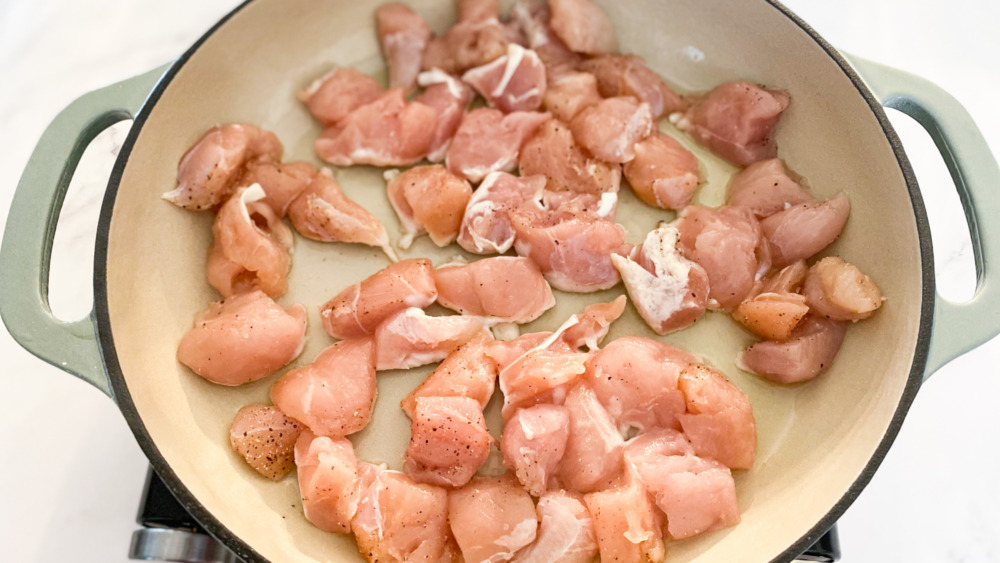 cubes of chicken cooking