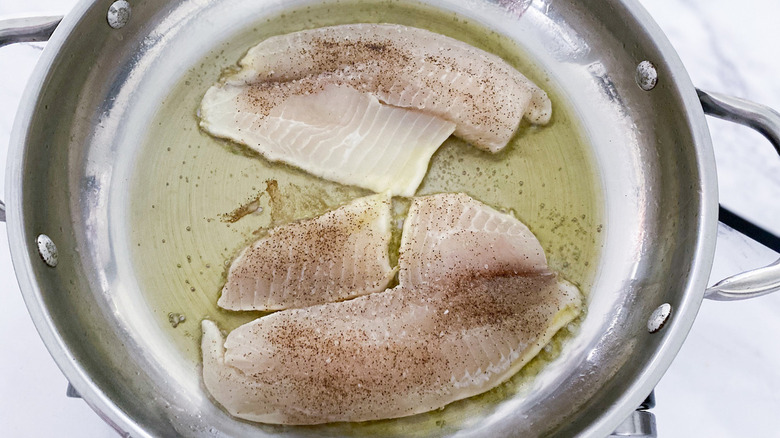 tilapia filets in a pan