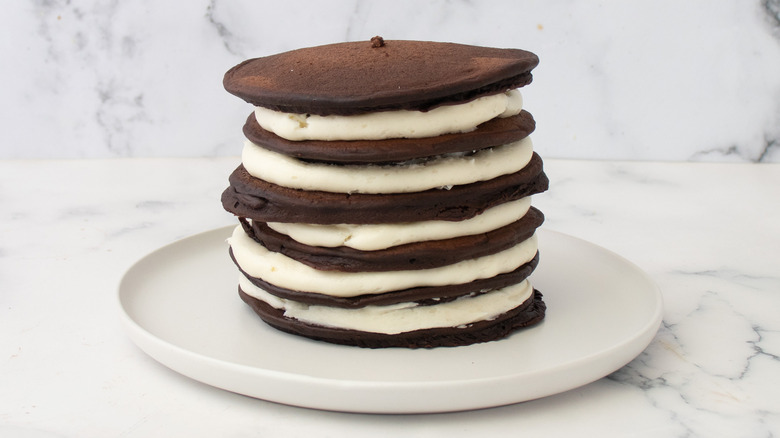 stacked oreo pancakes on plate