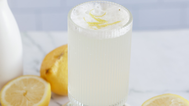 close up on drink with lemon shavings