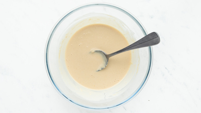 Tahini dressing in mixing bowl