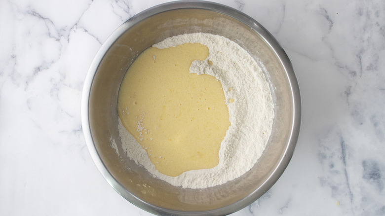 egg mixture and flour in metal bowl