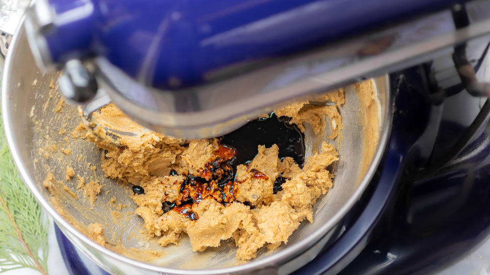 creaming butter and sugar to make a gingerbread house