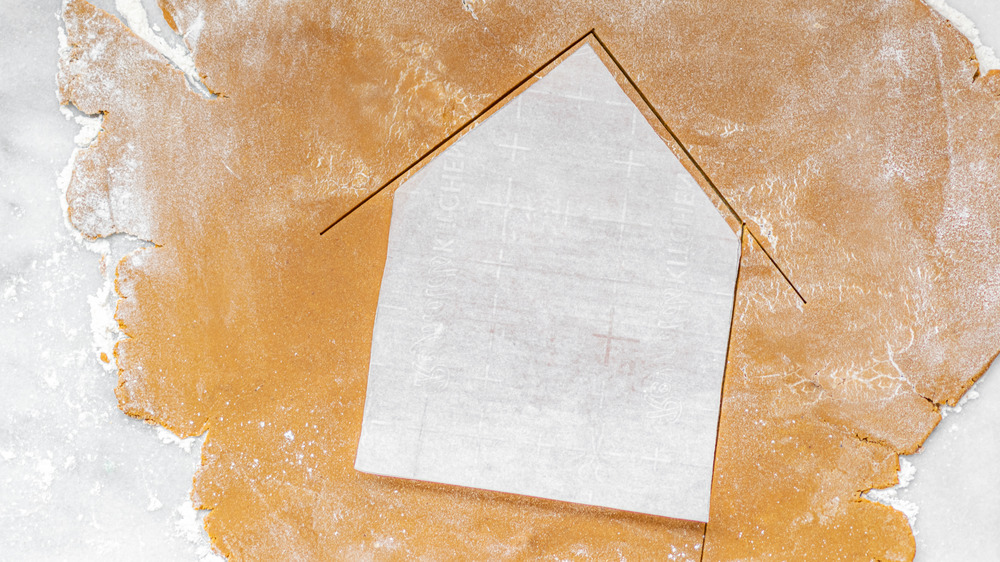 cutting out a gingerbread house