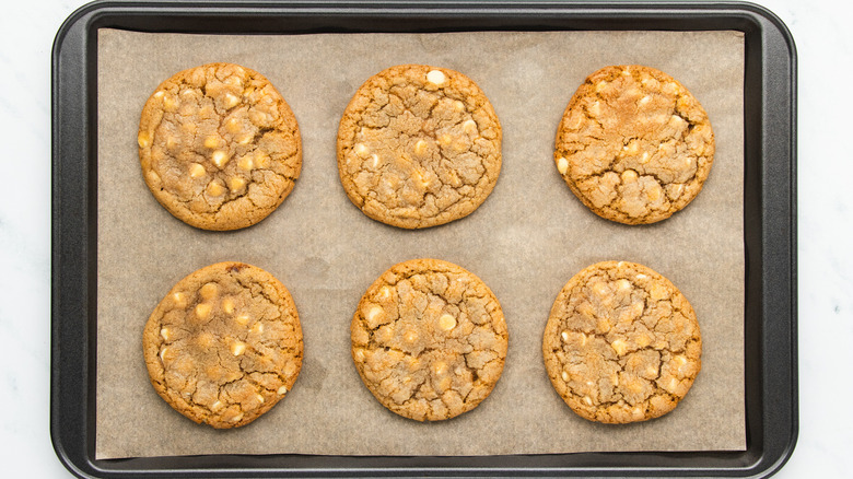 White chocolate ginger cookies on baking sheet