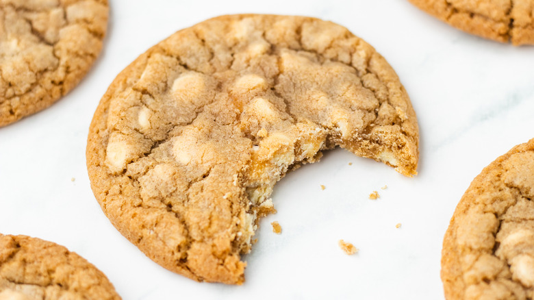 Gingerbread white chocolate chip cookie with bite taken out