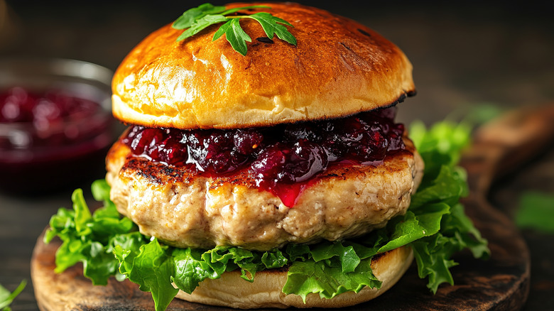 a juicy turkey burger with cranberry sauce