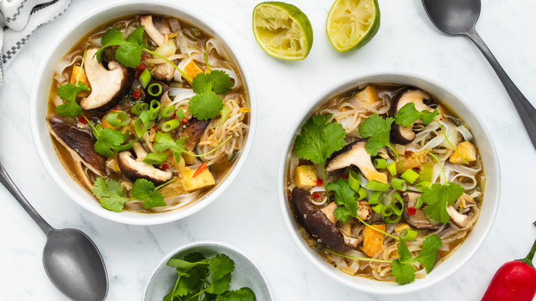 Vegetable noodle bowls on table