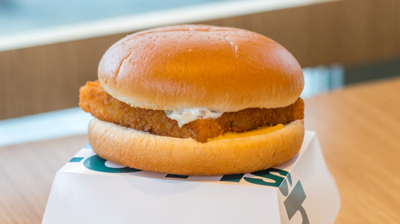 A McDonald's Filet-O-Fish on top of carton