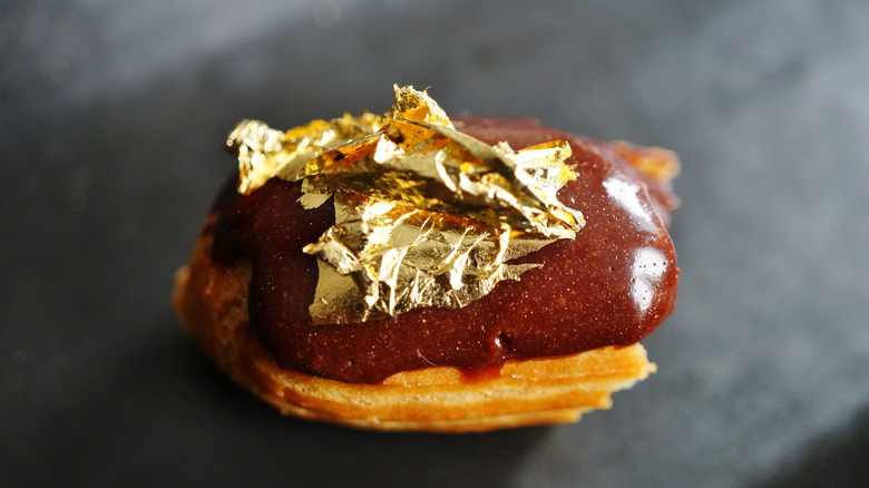 edible gold leaf on chocolate eclair