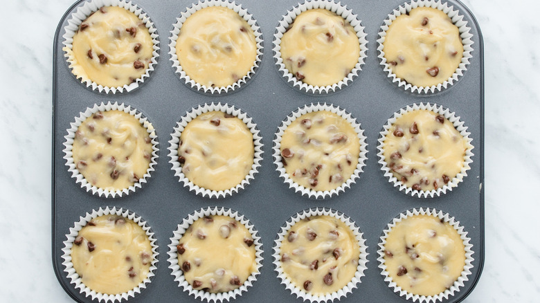 muffin batter in muffin tins 