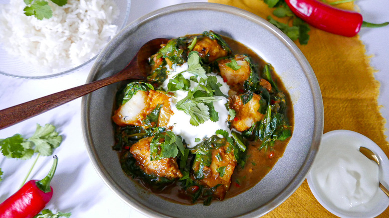 fish curry in bowl with cilantro