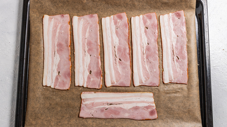 Bacon on a parchment-lined baking tray