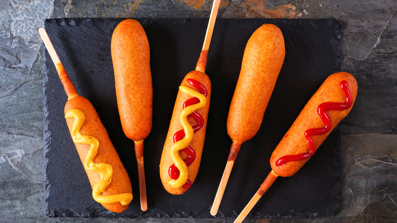 Corn dogs with toppings