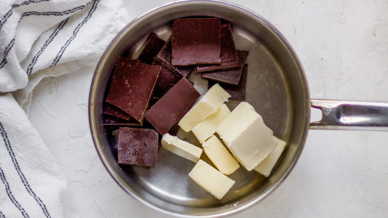 Bakers chocolate and butter in saucepan