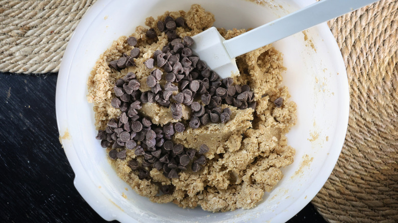 Mixing bowl of cookie dough and chocolate chips