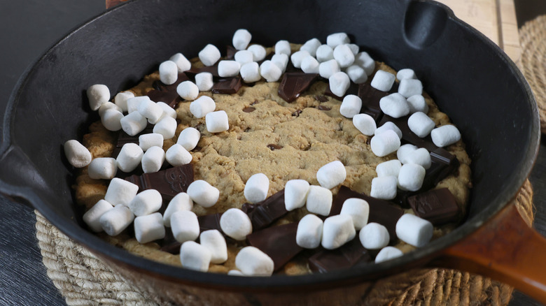 Skillet cookie covered with chocolate and marshmallows