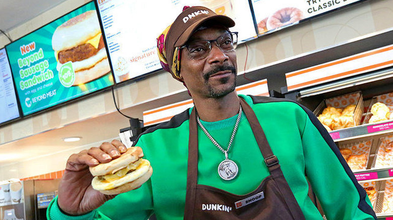 Snoop Dogg with a vegan burger