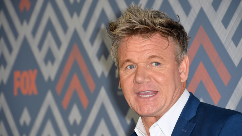 Gordon Ramsay talking in front of wall