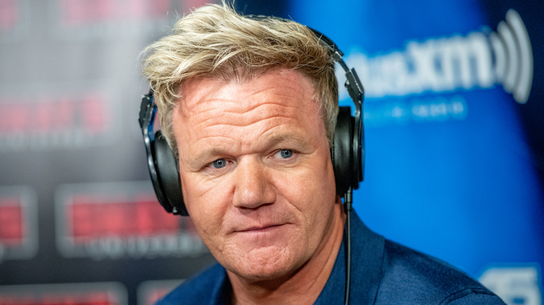 Gordon Ramsay wears earphones